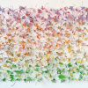 Muurbloemen I (2026), drukinkt op kunststof / ijzerdraad, 110 x 140 x 20 cm. (in opdracht gemaakt)